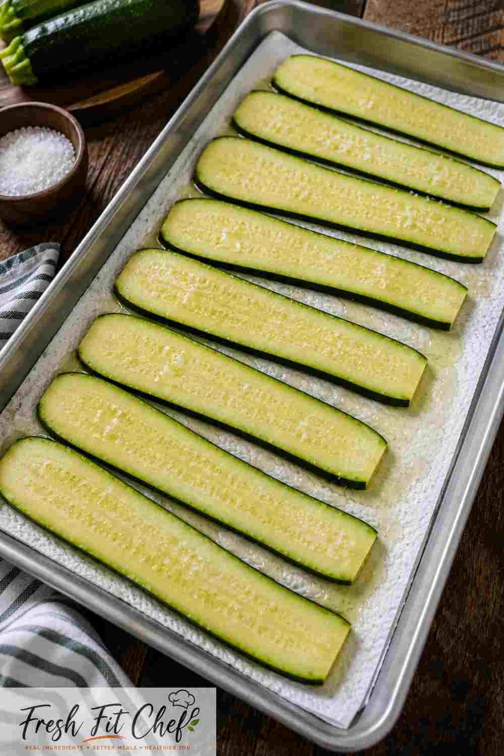 Salted zucchini releasing moisture before roasting for lasagna